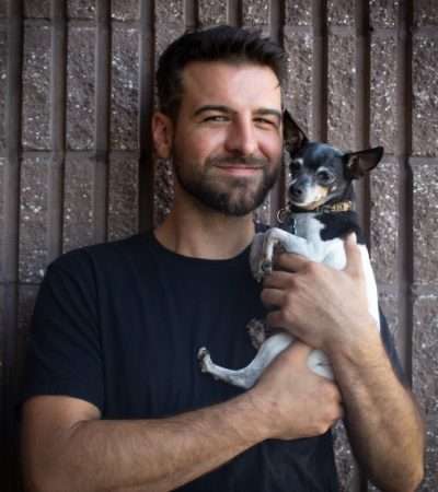 Travis Whiteside CEO & Master Technician (Also pictured: Eva, shop dog)